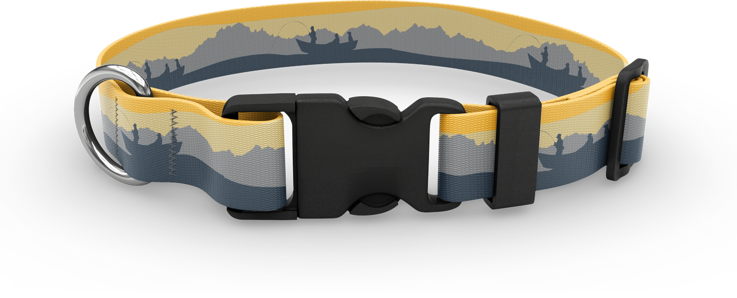 A dog collar with a black buckle and silver ring with silhouette a mountain range in the background and 3 people fishing from a bot in the foreground