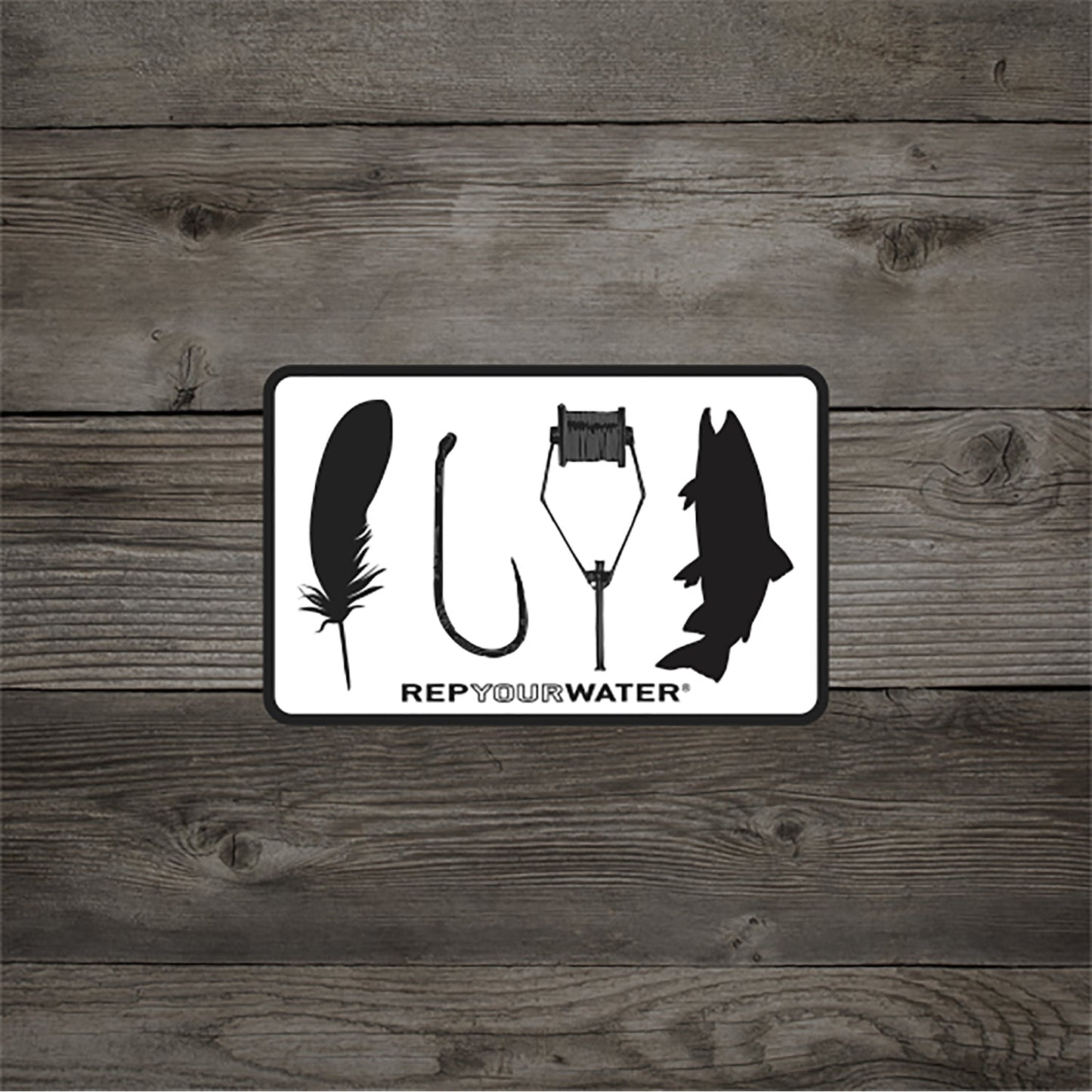 A wood background white sticker with black border that shows the silhouettes of a feather hook bobbin and trout with text that reads rep your water