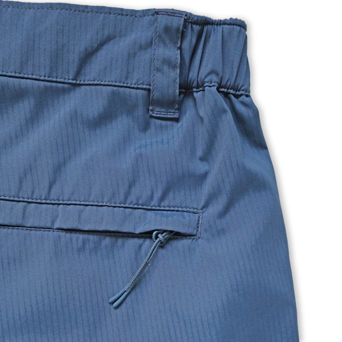 Close-up of blue short with a white background