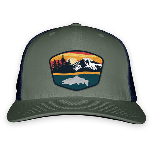 green front and navy mesh back hat with a patch of a sunset, mountain scape, and trout silhouette