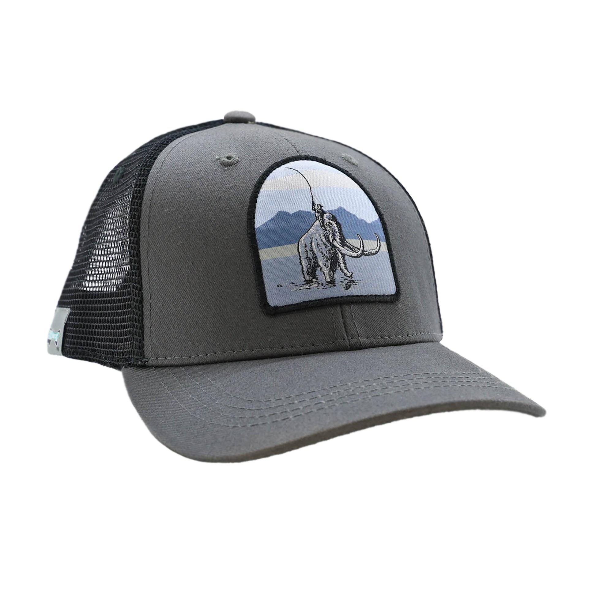 Gray hat with black mesh back and a patch on the front showing a sasquatch riding a mammoth while casting a fly rod
