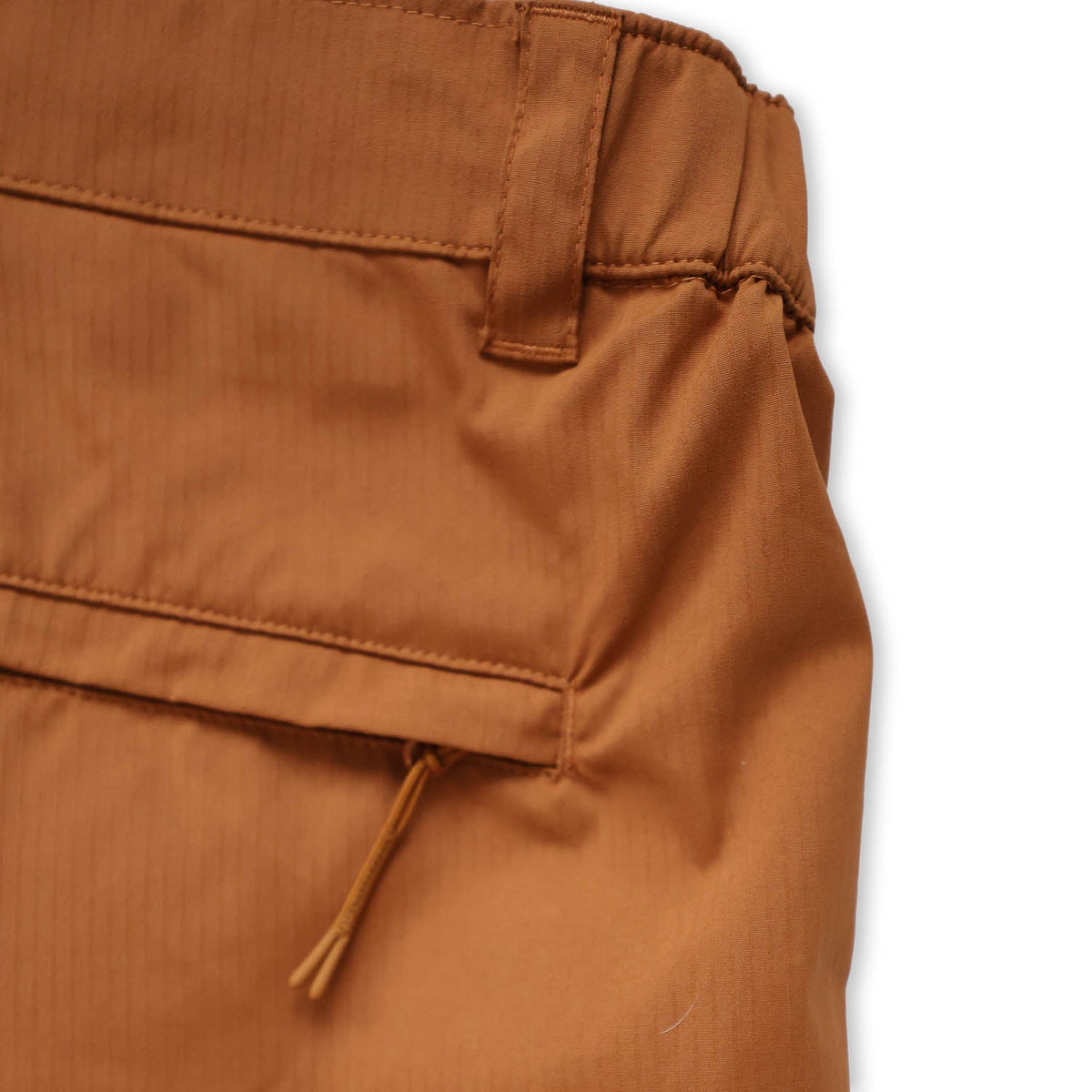 Close-up of teak pants with a white background