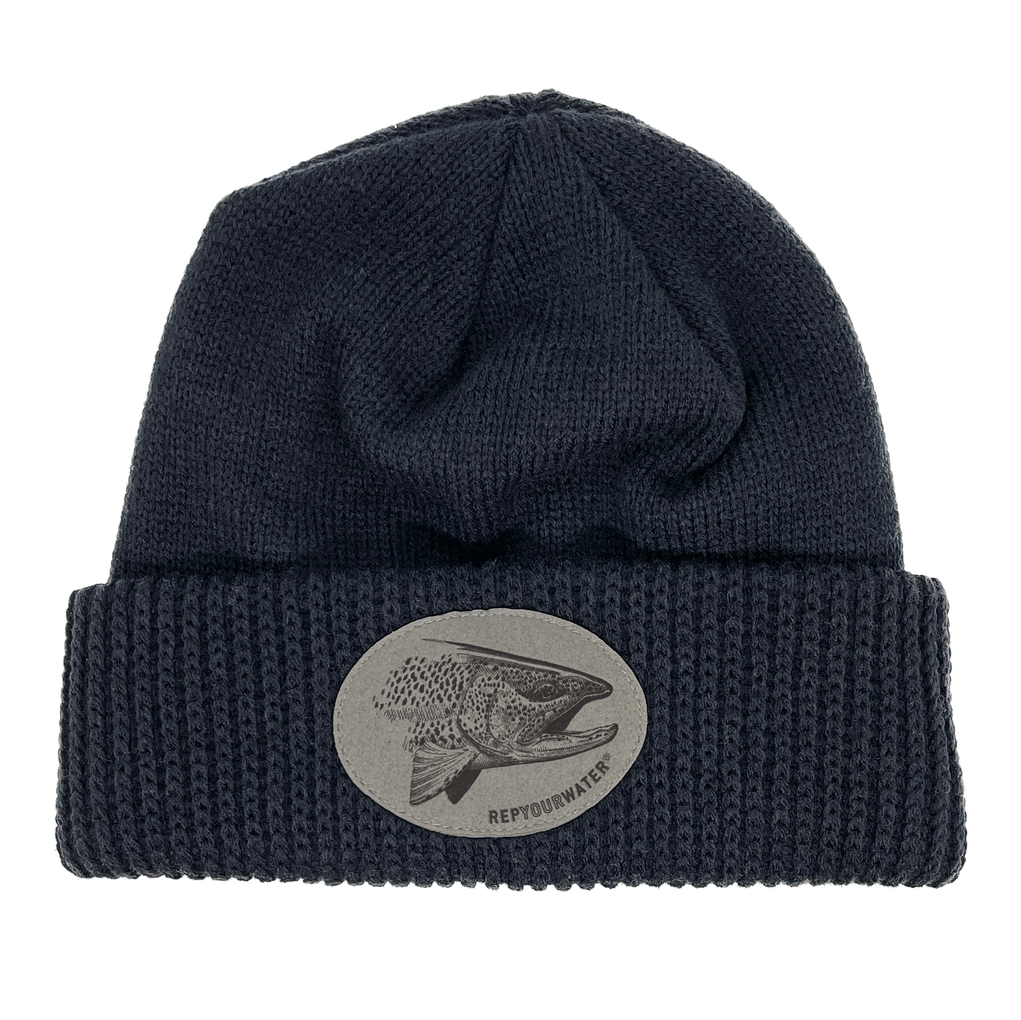 A dark navy winter hat with a cuff and a oval patch on the cuff with a pen and ink rainbow head in it