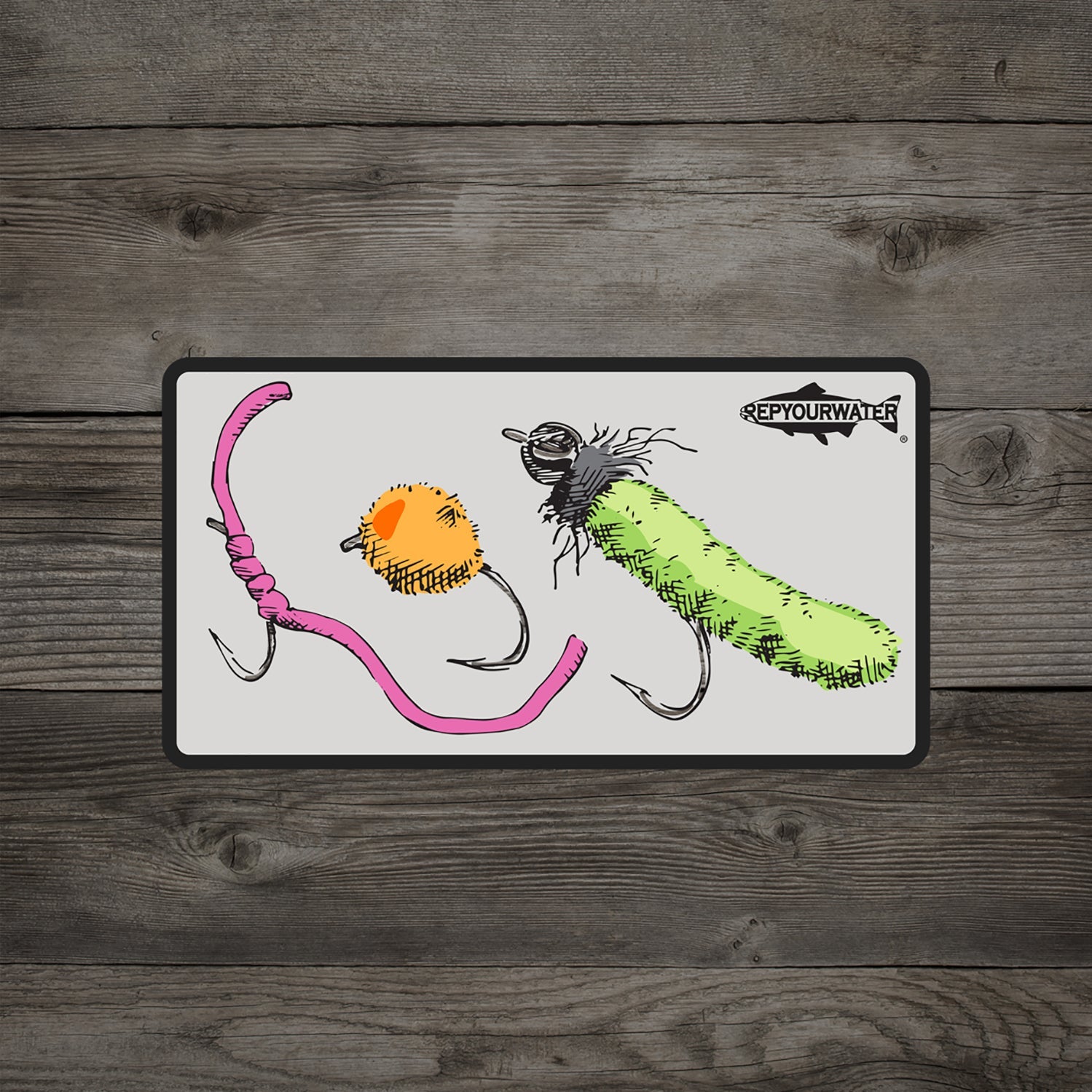 A wood background has a sticker on it featuring a worm fly egg fly and mop fly with a trout silhouette in the top right coner that reads rep your water