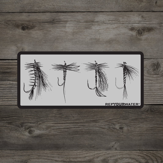 A wooden background has a sticker that shows four dry flies and the words repyourwater